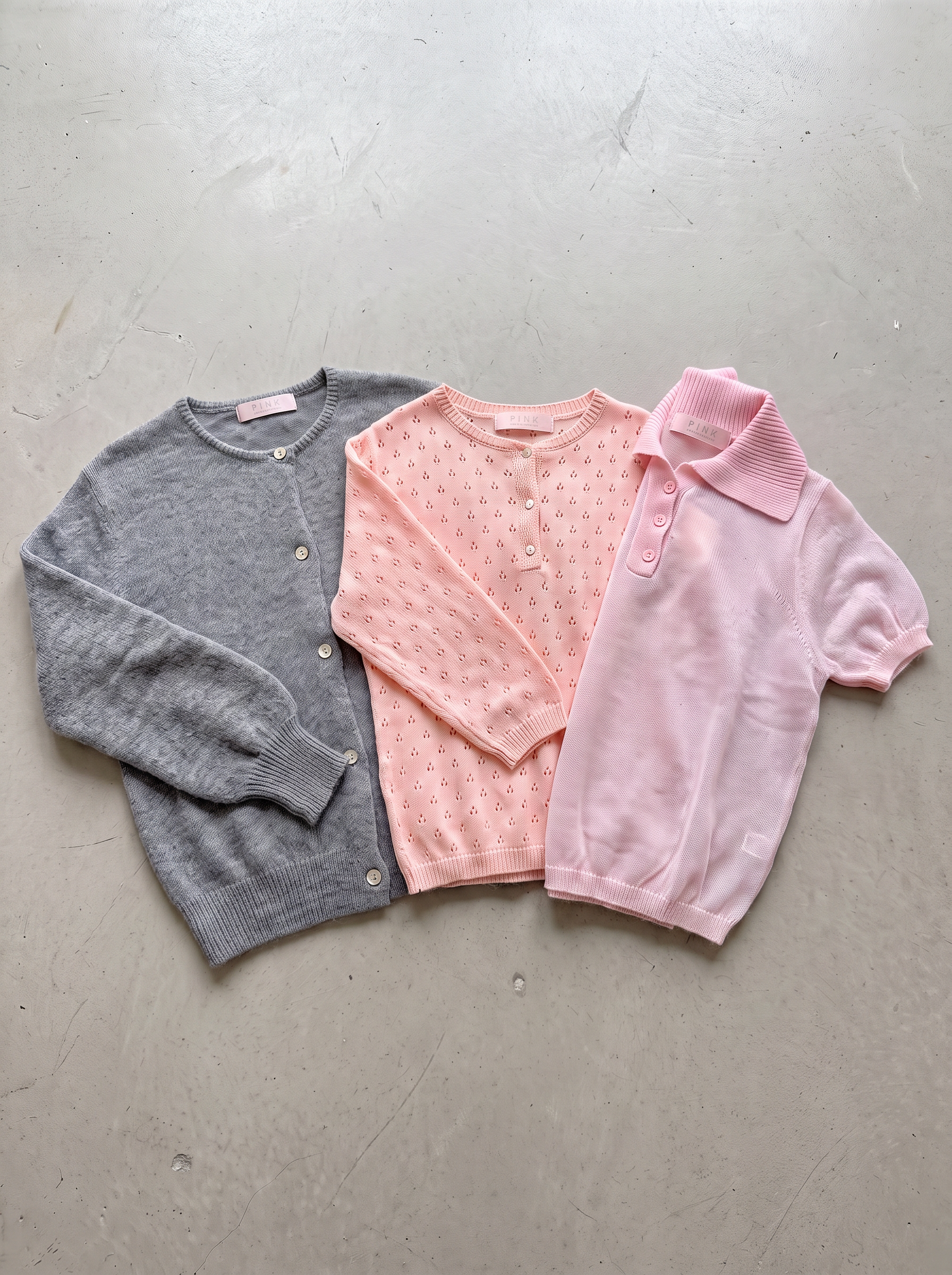 Mabel Grey, Elodie Peach and Clara Light Pink knits - flat lay