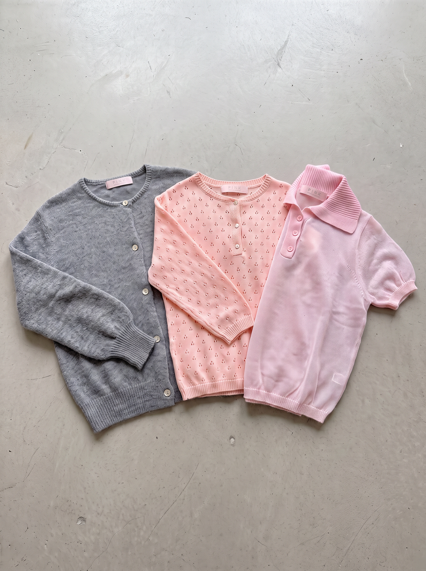 Mabel Grey, Elodie Peach and Clara Light Pink knits - flat lay